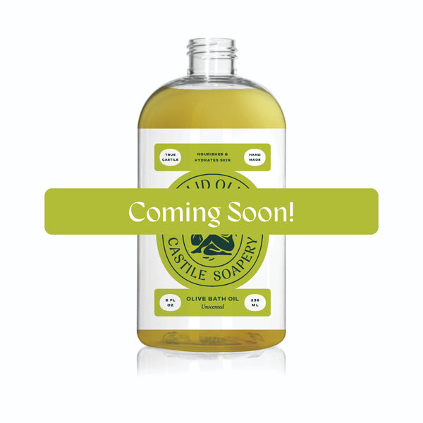 A bottle of unscented bath oil with a "Coming Soon" sign over it.