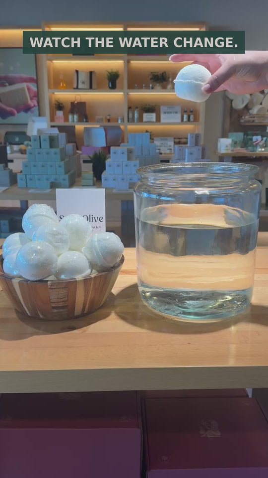 See a Solid Olive Epsom bath bomb fizz and disperse in water. Silent demonstration filmed in the shop.