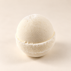 Close-up of Solid Olive Epsom bath bomb on an ivory background