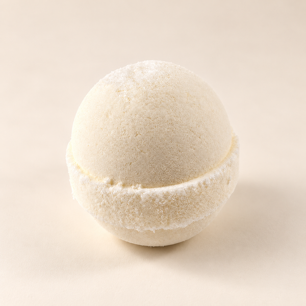 Close-up of Solid Olive Epsom bath bomb on an ivory background