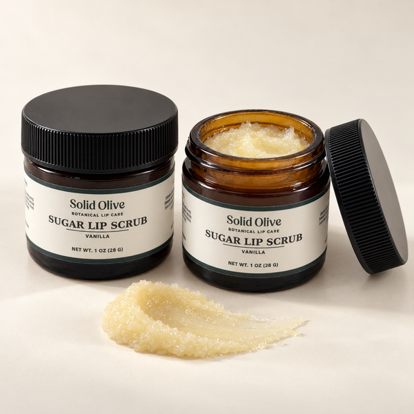 Solid Olive Vanilla Sugar Lip Scrub in 1 oz amber glass jars, showing its buttery sugar texture